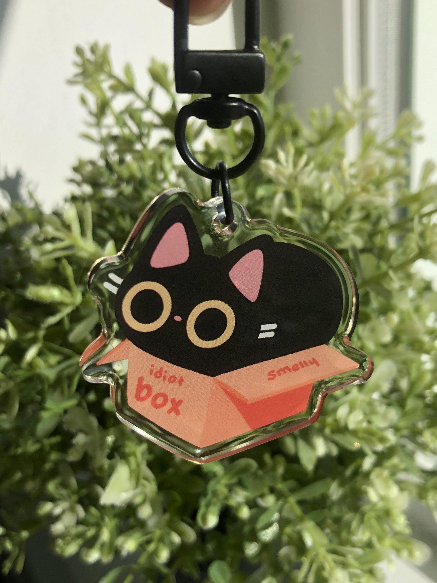 idiot box cat acrylic charm
